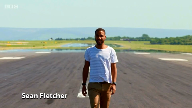 Sean Fletcher from BBC Countryfile does a piece to camera from the runway